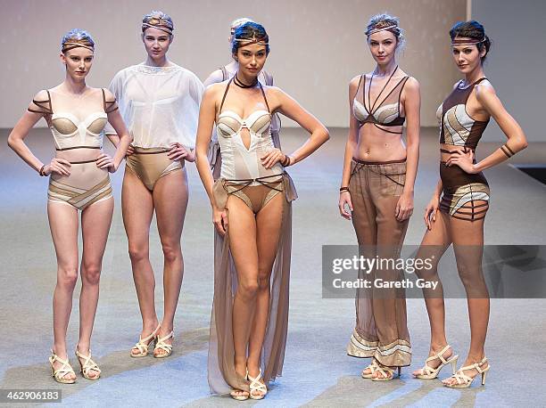 Models showcase designs by students on the runway at the The Hong Kong Polytechnic University show, during Hong Kong Fall/Winter Fashion Week at Hong...