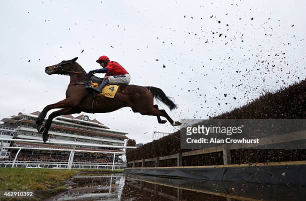 Aidan Coleman riding Houblan Des Obeaux in action at Newbury racecourse on February 07, 2015 in Newbury, England.