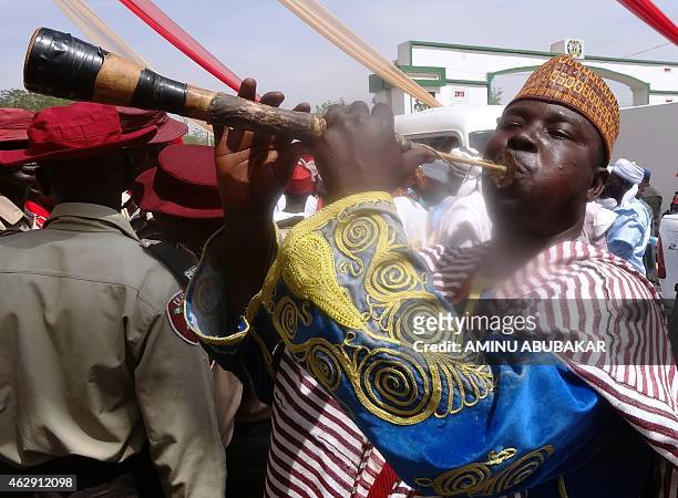 Flutist performs outside the Coronation Hall, the venue of the investiture of Muhammadu Sanusi II as the 57th emir of the ancient Kano emirate on...