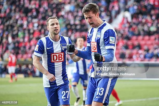 Jens Hegeler of Berlin celebrates his team's first goal with team mate Roy Beerens during the Bundesliga match between 1. FSV Mainz 05 and Hertha BSC...