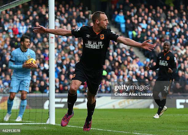 David Meyler of Hull City celebrates scoring the first goal during the Barclays Premier League match between Manchester City and Hull City at the...