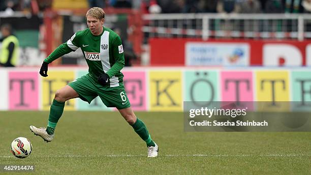 Kevin Schoeneberg of Muenster controls the ball during the 3. Liga match between Preussen Muenster and VfL Osnabrueck at Preussenstadion on February...