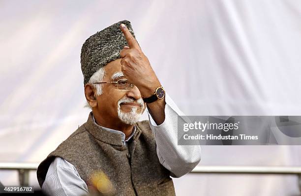 Vice President Hamid Ansari showing inked finger after cast his vote at Nirman Bhawan during the Delhi Assembly Elections 2015, on February 7, 2015...