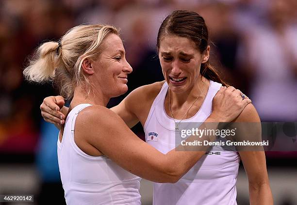 Andrea Petkovic of Germany celebrates with team captai Barbara Rittner after her victory in her single match against Samantha Stosur of Australia...