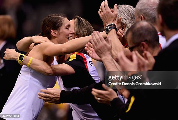 Andrea Petkovic of Germany celebrates with team mates after her victory in her single match against Samantha Stosur of Australia during the Fed Cup...