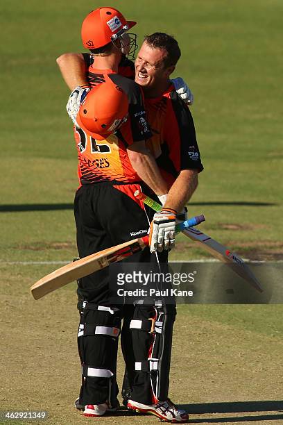 Adam Voges of the Scorchers congratulates Craig Simmons after scoring his century during the Big Bash League match between the Perth Scorchers and...