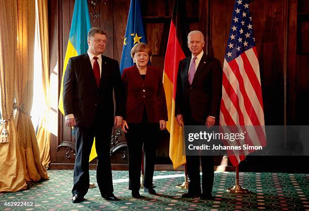 Petro Poroshenko, president of the Ukraine, German Chancellor Angela Merkel and US Vice President Joe Biden pose ahead of a bilateral meeting at the...