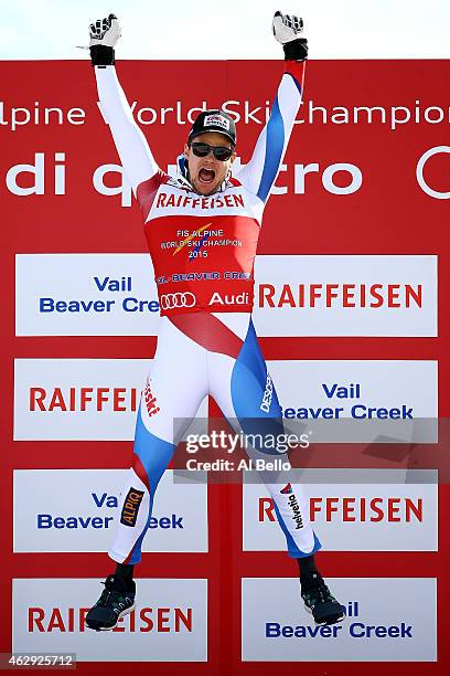 Gold medalist Patrick Kueng of Switzerland celebrates on the podium after the finish of the Men's Downhill in Red Tail Stadium on Day 6 of the 2015...