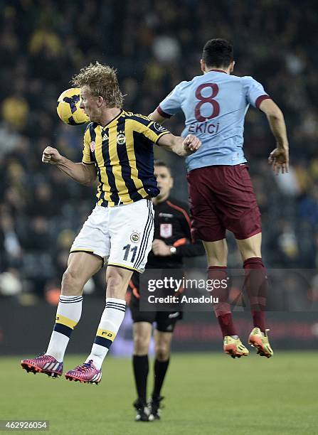 Dirk Kuyt of Fenerbahce vies for the ball with Mehmet Ekici of Trabzonspor during the Turkish Spor Toto Spor League soccer match between Fenerbahce...