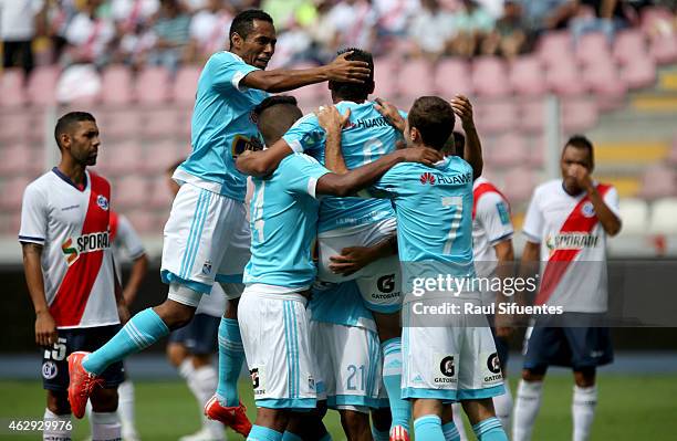 Cesar Pereyra of Sporting Cristal celebrates with his teammates after scoring the first goal of his team against Deportivo Municipal during a match...