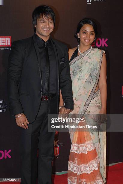 Indian Bollywood actor Vivek Oberoi with his wife Priyanka during the 20th Annual Life OK Screen Awards on January 14, 2014 in Mumbai, India.