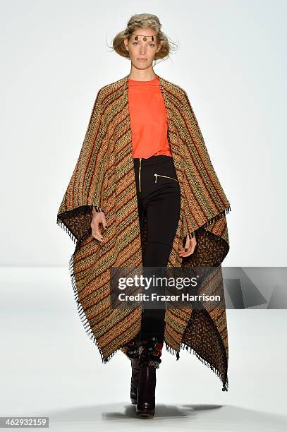 Model walks the runway at the Holy Ghost show during Mercedes-Benz Fashion Week Autumn/Winter 2014/15 at Brandenburg Gate on January 16, 2014 in...