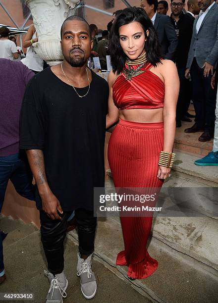 Kanye West, speculated to be wearing the Yeezy 3 sneakers "Yeezy 750 Boost", and Kim Kardashian attend the Roc Nation and Three Six Zero Pre-GRAMMY...