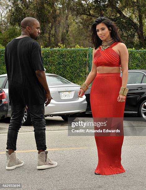 Kim Kardashian and Kanye West, speculated to be wearing the Yeezy 3 sneakers "Yeezy 750 Boost", arrive at the Roc Nation Grammy Brunch 2015 on...