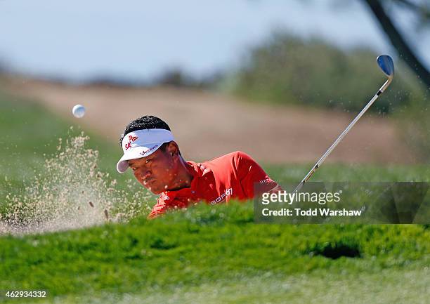 Choi of South Korea plays a shot out of the bunker on the fourth hole during the third round of the Farmers Insurance Open at Torrey Pines South on...