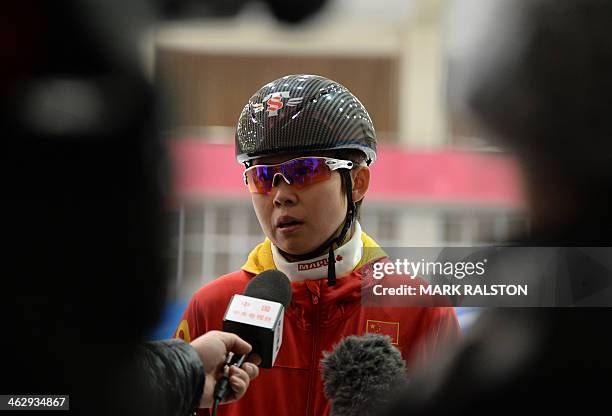 This photo taken on December 20, 2013 shows Chinese short track speed skater Wang Meng during an interview after a practice session in Beijing....