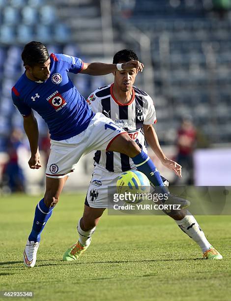 Cruz Azul's midfielder Joao Rojas vies for the ball with Monterrey's defender Severo Meza during their Clausura tournament football match at the Azul...