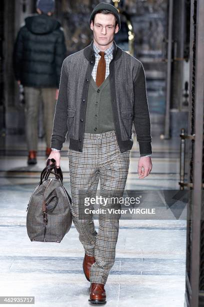 Model walks the runway at the Hackett show during The London Collections: Men Autumn/Winter 2014 at Freemasons' Hall on January 7, 2014 in London,...
