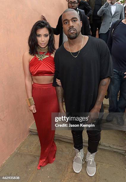 Personality Kim Kardashian and recording artist Kanye West, speculated to be wearing the Yeezy 3 sneakers "Yeezy 750 Boost", attend Roc Nation and...