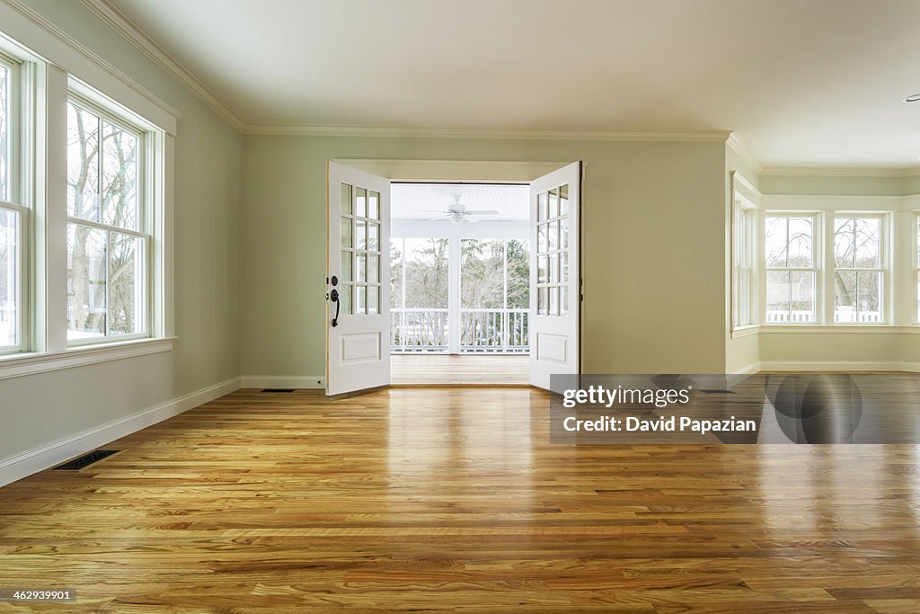 Unfurnished family room with hardwood floors