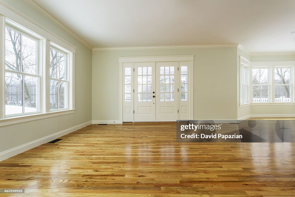 Unfurnished family room with hardwood floors