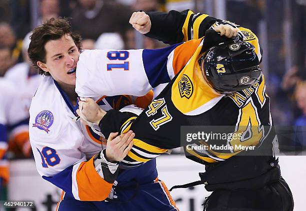 Ryan Strome of the New York Islanders and Torey Krug of the Boston Bruins exchange punches during the first period at TD Garden on February 7, 2015...