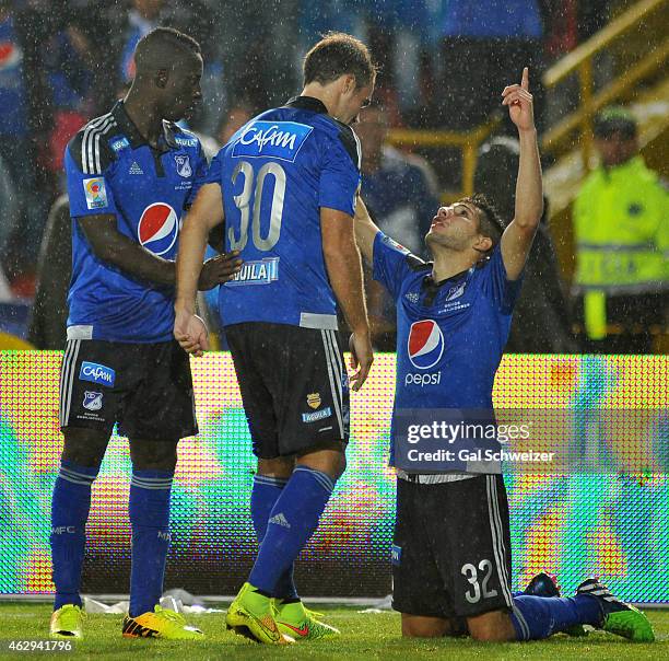 Jonathan Agudelo of Millonarios celebrates with teammates Federico Insua and Deiver Machado after scoring his first goal during a match between...
