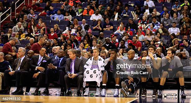 Members of the Brooklyn Nets sit on the bench during the closing minutes of their 114-77 loss to the Washington Wizards at Verizon Center on February...