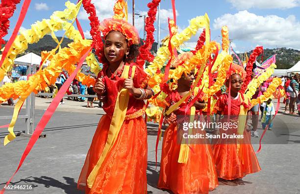 Young masqueraders perform in the Queen's Park Savannah during the Red Cross Society Children's Carnival competition as part of Trinidad and Tobago...