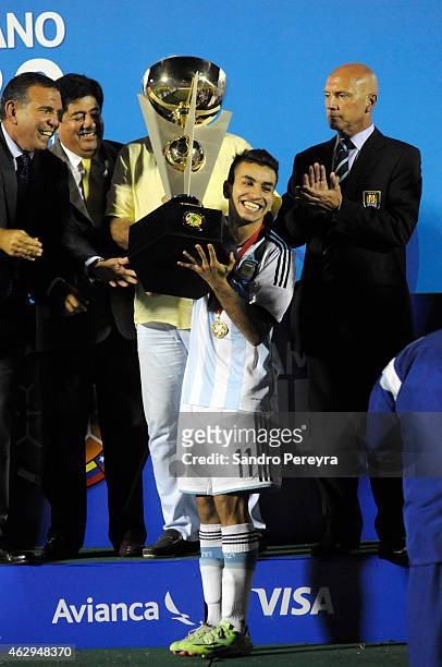 Angel Correa of Argentina lifts the trophy after winning the title at the end of the match between Argentina and Uruguay as part of South American...