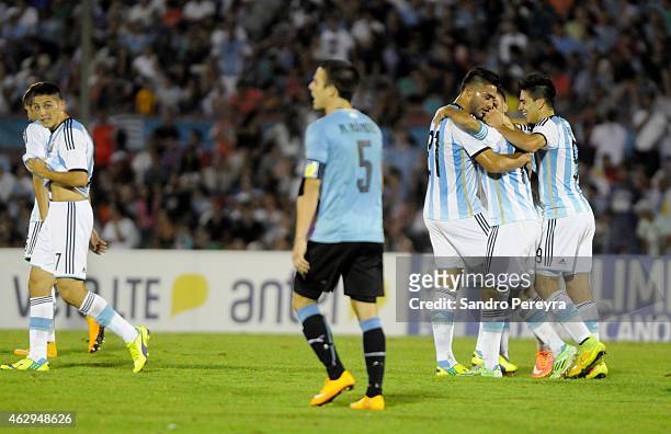 Angel Correa of Argentina celebrates with teammates after scoring the second goal of his team during a match between Argentina and Uruguay as part of...