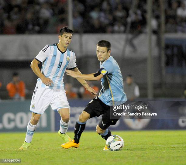 Giovanni Simeone of Argentina struggles for the ball with Nahitan Nández of Uruguay during a match between Argentina and Uruguay as part of South...