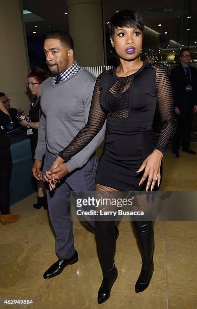 Professional wrestler David Otunga and recording artist Jennifer Hudson attend the Pre-GRAMMY Gala and Salute To Industry Icons honoring Martin...