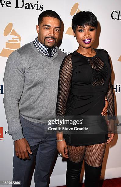 Professional wrestler David Otunga and recording artist Jennifer Hudson attend the Pre-GRAMMY Gala and Salute To Industry Icons honoring Martin...