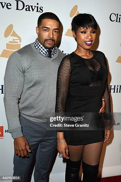 Professional wrestler David Otunga and recording artist Jennifer Hudson attend the Pre-GRAMMY Gala and Salute To Industry Icons honoring Martin...