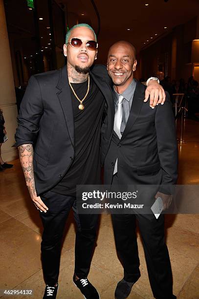 Chris Brown and BET president of programming Stephen Hill attend the Pre-GRAMMY Gala And Salute To Industry Icons Honoring Martin Bandier at The...