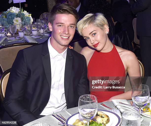 Recording artist Miley Cyrus and Patrick Schwarzenegger attend the Pre-GRAMMY Gala and Salute to Industry Icons honoring Martin Bandier at The...