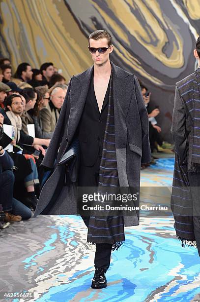 Model walks the runway during the Louis Vuitton Menswear Fall/Winter 2014-2015 show as part of Paris Fashion Week on January 16, 2014 in Paris,...
