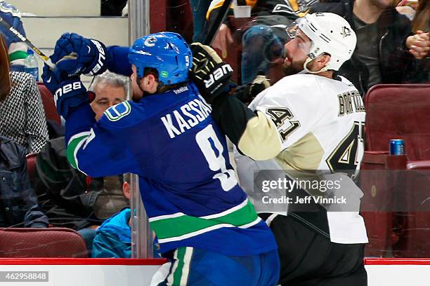 Zack Kassian of the Vancouver Canucks collides with Robert Bortuzzo of the Pittsburgh Penguins during their NHL game at Rogers Arena February 7, 2015...