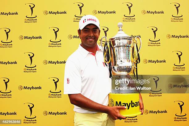 Anirban Lahiri of India poses with the trophy after victory during the final round of the Maybank Malaysian Open at Kuala Lumpur Golf & Country Club...
