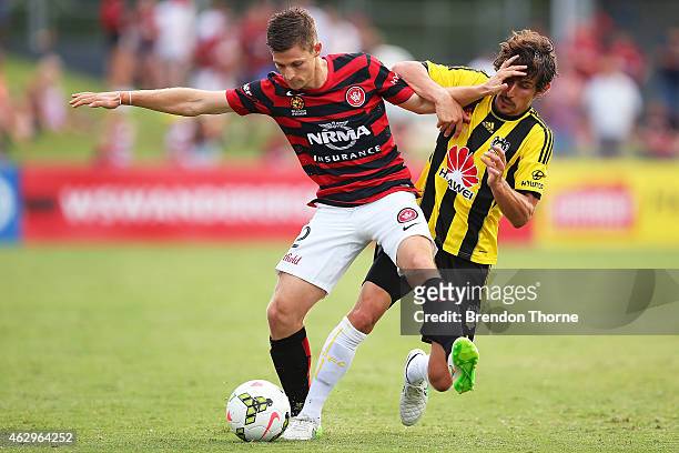Shannon Cole of the Wanderers competes with Albert Riera of the Phoenix during the round 16 A-League match between the Western Sydney Wanderers and...