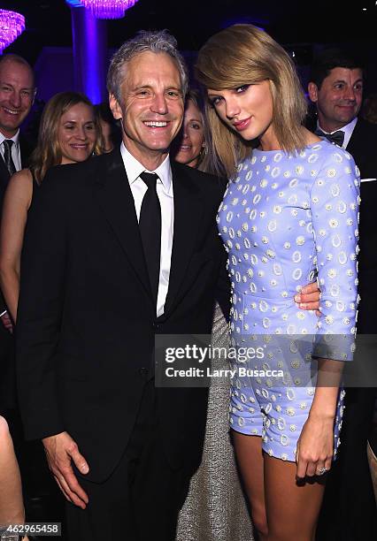 Clear Channel President of Entertainment Enterprises John Sykes and recording artist Taylor Swift attend the Pre-GRAMMY Gala and Salute to Industry...