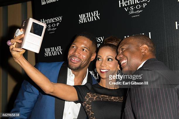 Personality Michael Strahan, Holly Robinson Peete and husband Michael Peete attend the Hennessy Toasts Achievements on February 7, 2015 in Los...