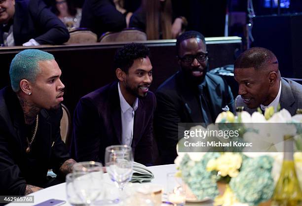 Recording artists Chris Brown, Miguel and actor/recording artist Jamie Foxx attend the Pre-GRAMMY Gala and Salute to Industry Icons honoring Martin...