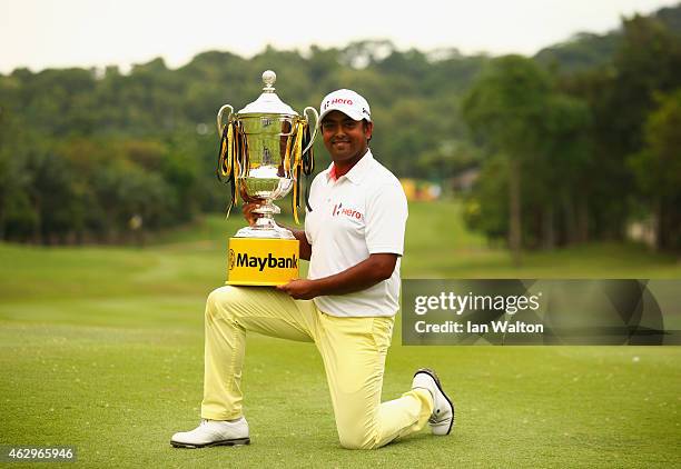 Anirban Lahiri of India poses with the trophy after victory during the final round of the Maybank Malaysian Open at Kuala Lumpur Golf & Country Club...