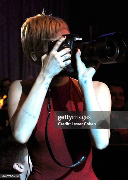 Singer Miley Cyrus takes a photo at the Pre-GRAMMY Gala and Salute to Industry Icons honoring Martin Bandier at The Beverly Hilton Hotel on February...