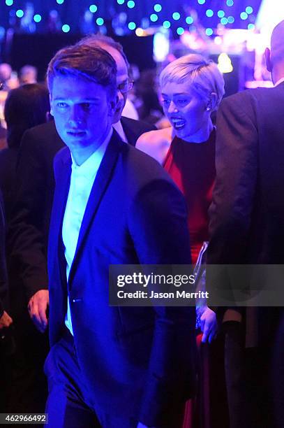Model Patrick Schwarzenegger and singer Miley Cyrus attend the Pre-GRAMMY Gala and Salute to Industry Icons honoring Martin Bandier at The Beverly...