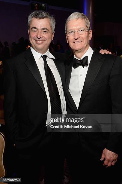 Apple Senior Vice President of Internet Software and Services Eddy Cue and Apple CEO Tim Cook attend the Pre-GRAMMY Gala and Salute to Industry Icons...