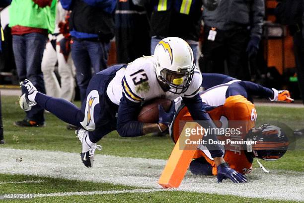 Keenan Allen of the San Diego Chargers scores a fourth quarter touchdown against Michael Huff of the Denver Broncos during the AFC Divisional Playoff...