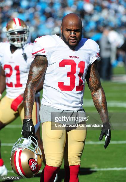 Donte Whitner of the San Francisco 49ers warms up before the NFC Divisional Playoff Game against the Carolina Panthers at Bank of America Stadium on...